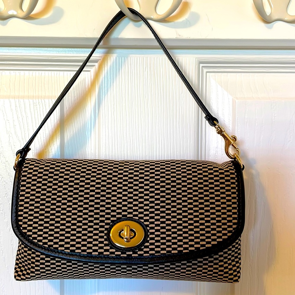 Black/tan canvas purse with leather trim and gold twist clasp/hardware